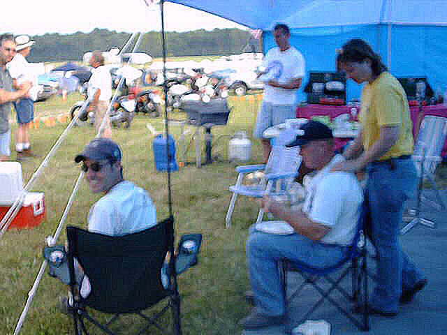 Sitting down is Cody Stone. twostroke fanatic from Minnesota. His current regular rider is a Kaw H1 with a rubber mounted H2 motor, Mr. & Mrs Iron Butt... (Allen and Bobbie Wood,).  Russ in the back.