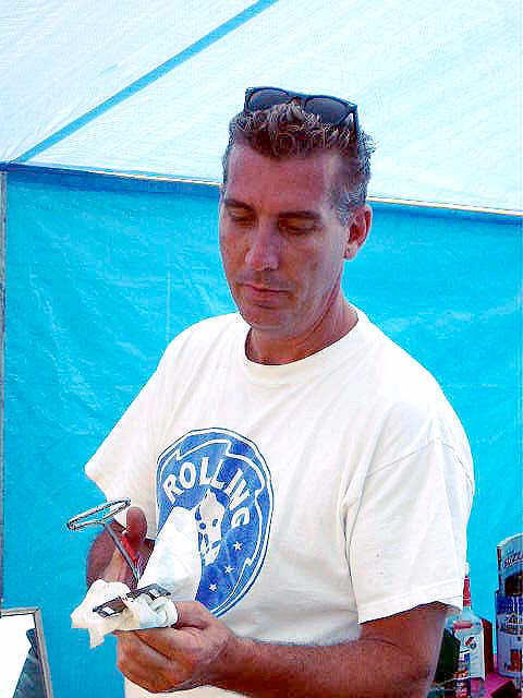 Our beloved Den mother, Russ, burning some ribs... (just the way I like 'em...)